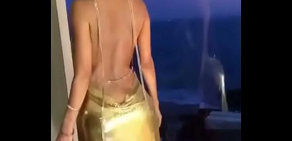  Sexy young girl is showing her sexy golden dress